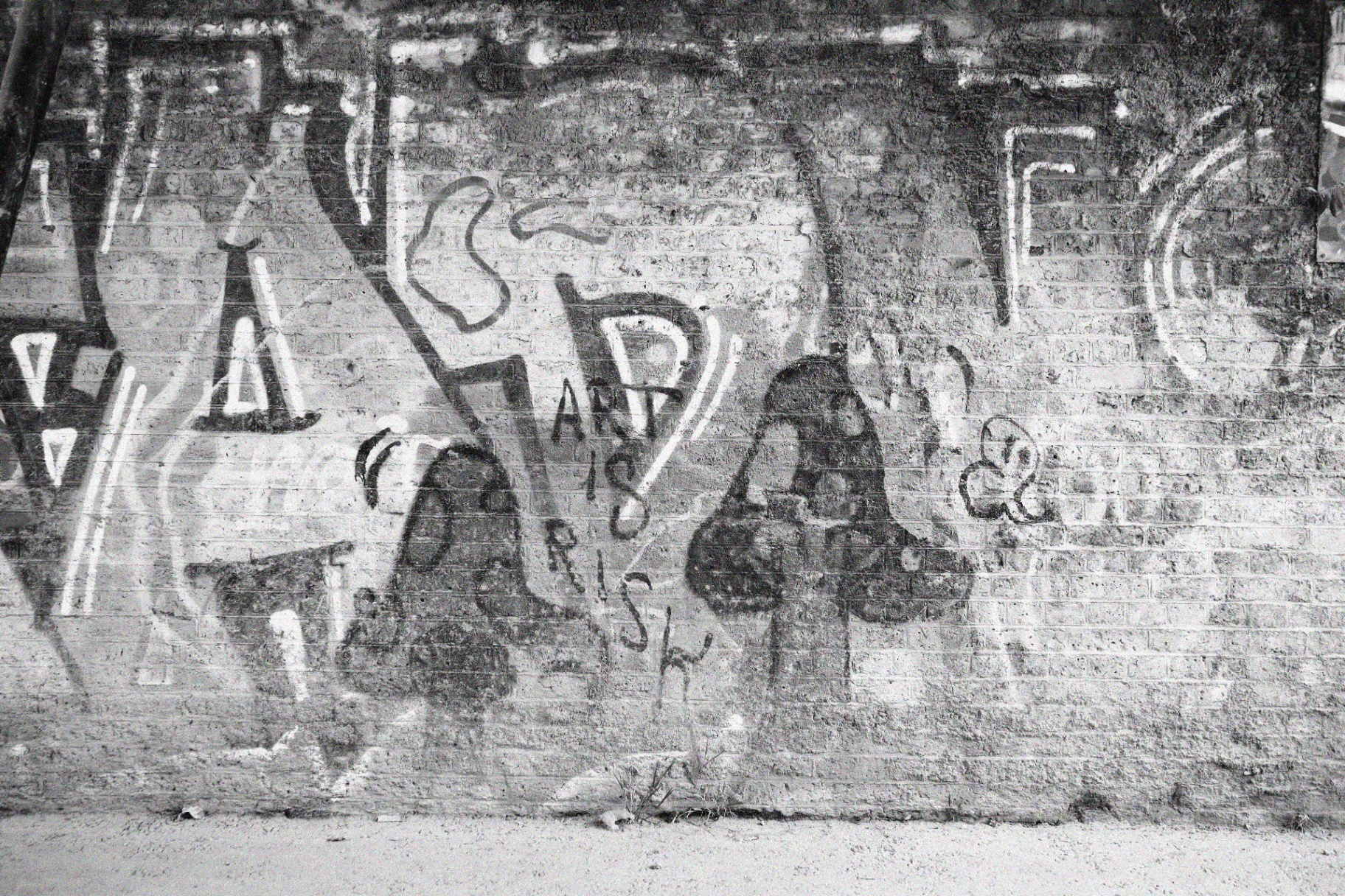 Brick wall with graffiti reading 'Art is risk'